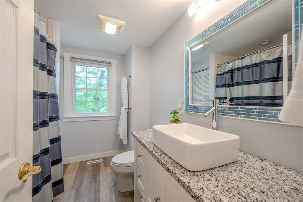 11 Lakeside Road Billerica, MA 01821 - Photo 22 of 38 a bathroom with a sink toilet and shower