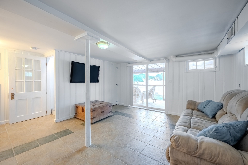 11 Lakeside Road Billerica, MA 01821 - Photo 24 of 38 a living room with furniture and a flat screen tv