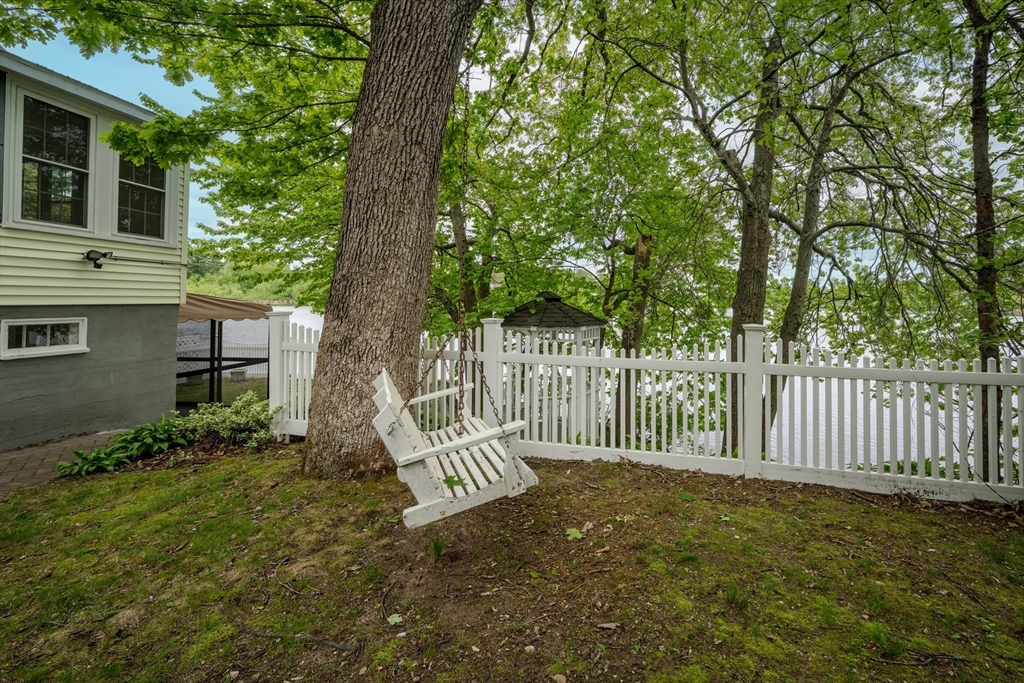 11 Lakeside Road Billerica, MA 01821 - Photo 34 of 38 a view of a house with a small yard and wooden fence