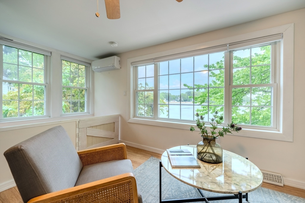 11 Lakeside Road Billerica, MA 01821 - Photo 9 of 38 a living room with furniture and a potted plant