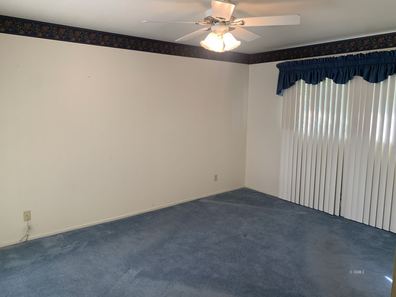 328 Ashton Street Ridgecrest, CA 93555 - Photo 16 of 28 an empty room with a chandelier fan