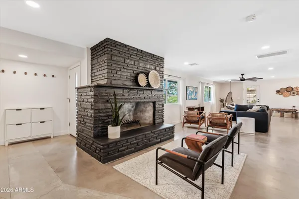 a living room with furniture and a fireplace