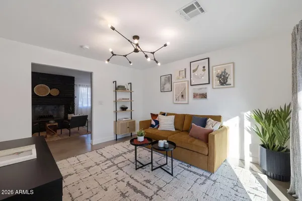 a living room with furniture and a large window