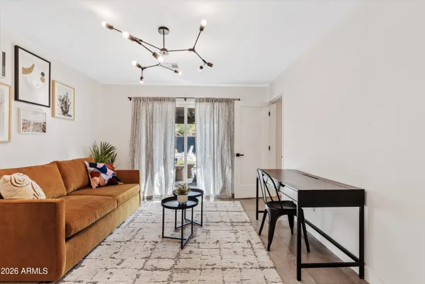 a view of a livingroom with furniture and window