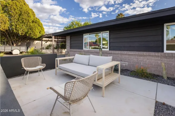 a outdoor living space with furniture and a potted plant