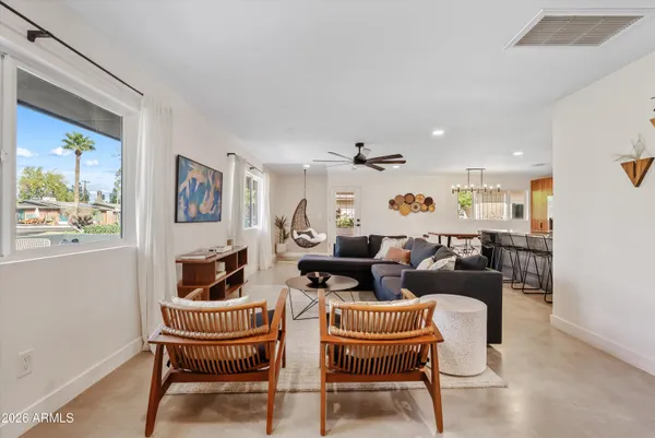 a living room with furniture and a window