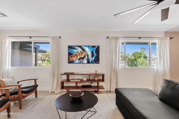 a living room with furniture and a window
