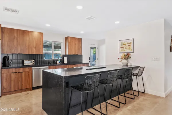 a kitchen with a sink and cabinets