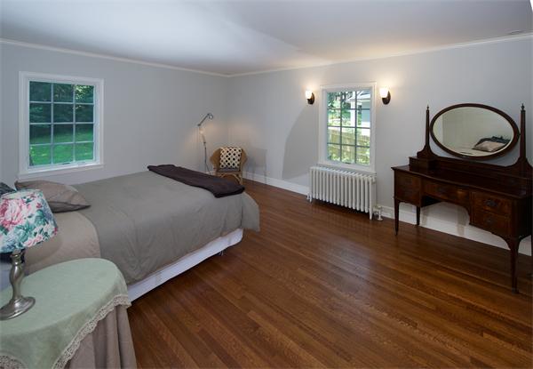31 Sheffield Road Newton, MA 02460 - Photo 15 of 16 a bedroom with a bed a dresser and a window