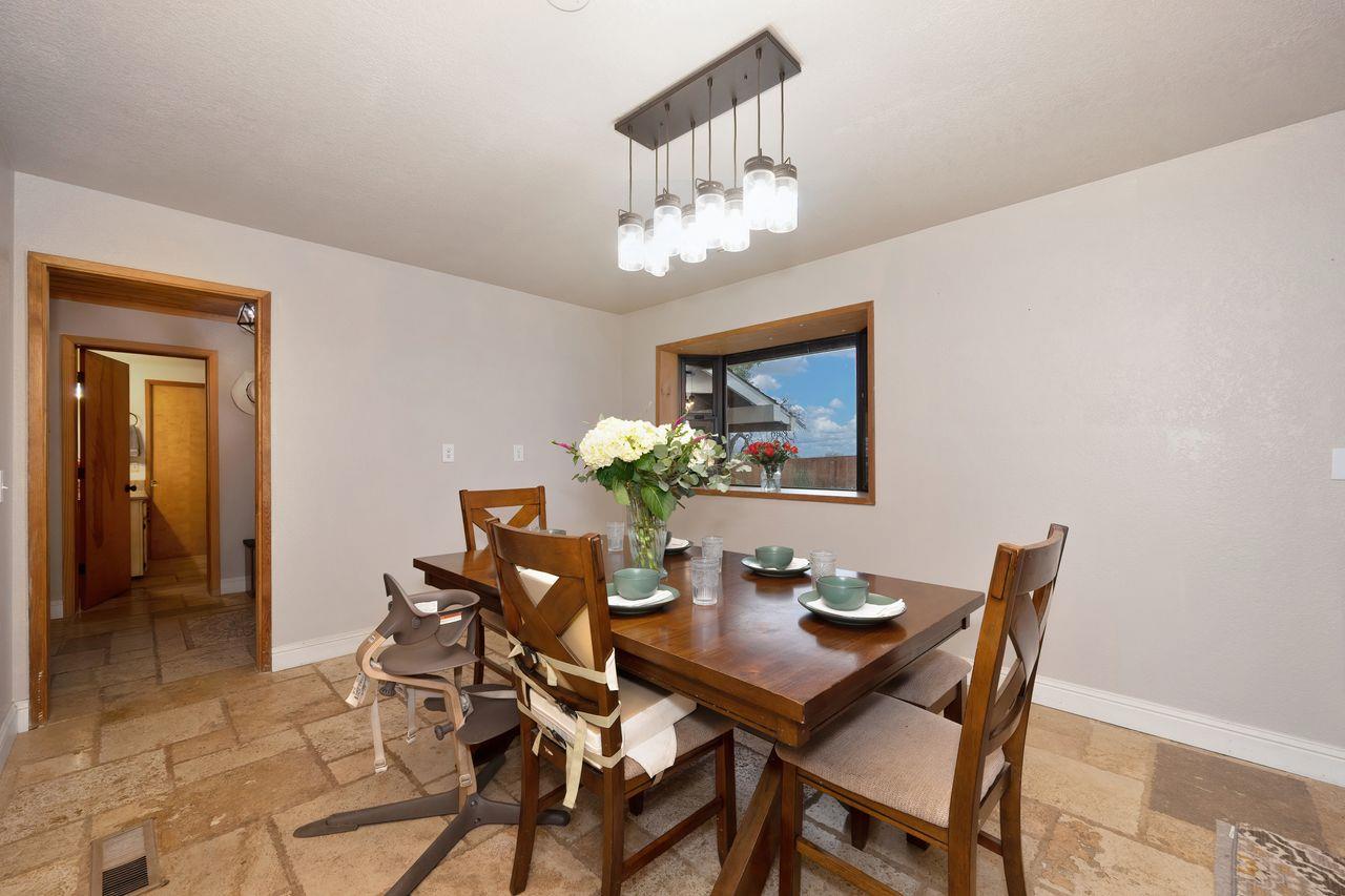 5501 Scott Road Sloughhouse, CA 95683 - Photo 11 of 87 a view of a dining room with furniture and chandelier
