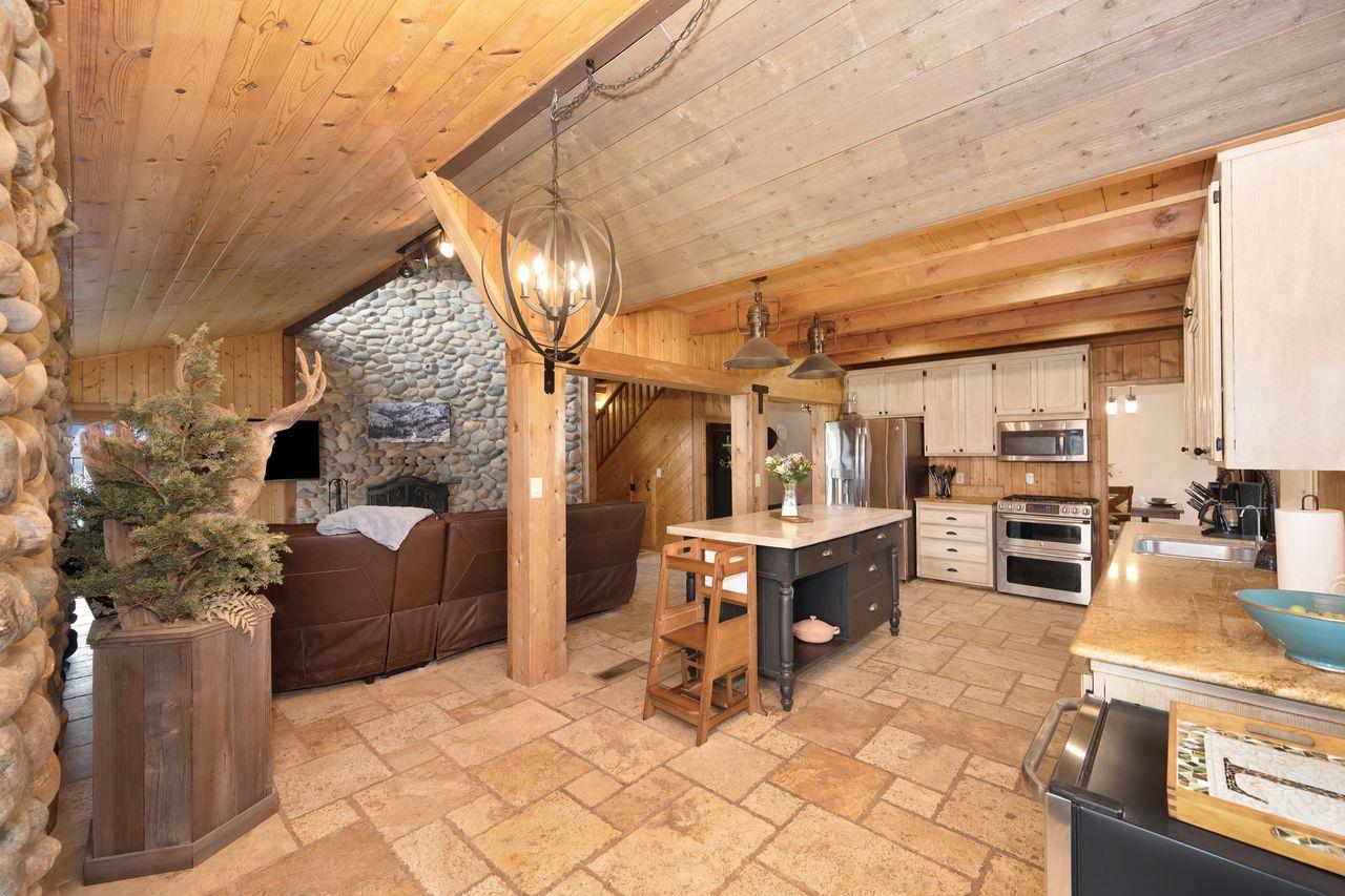 5501 Scott Road Sloughhouse, CA 95683 - Photo 22 of 87 a view of a patio with dining table and chairs with wooden floor and fence