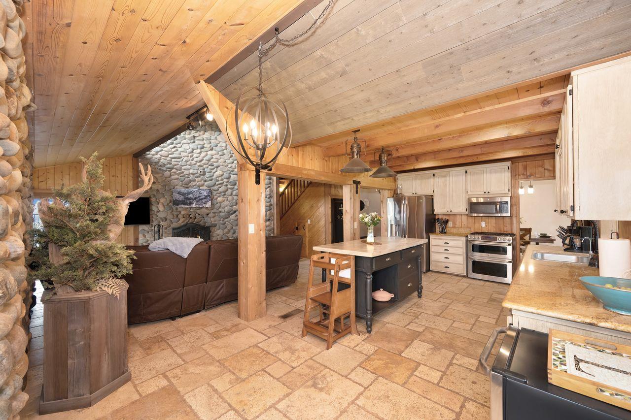 5501 Scott Road Sloughhouse, CA 95683 - Photo 23 of 87 a view of a patio with dining table and chairs with wooden floor and fence