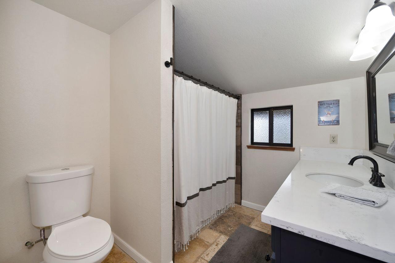 5501 Scott Road Sloughhouse, CA 95683 - Photo 39 of 87 a bathroom with a sink toilet and shower