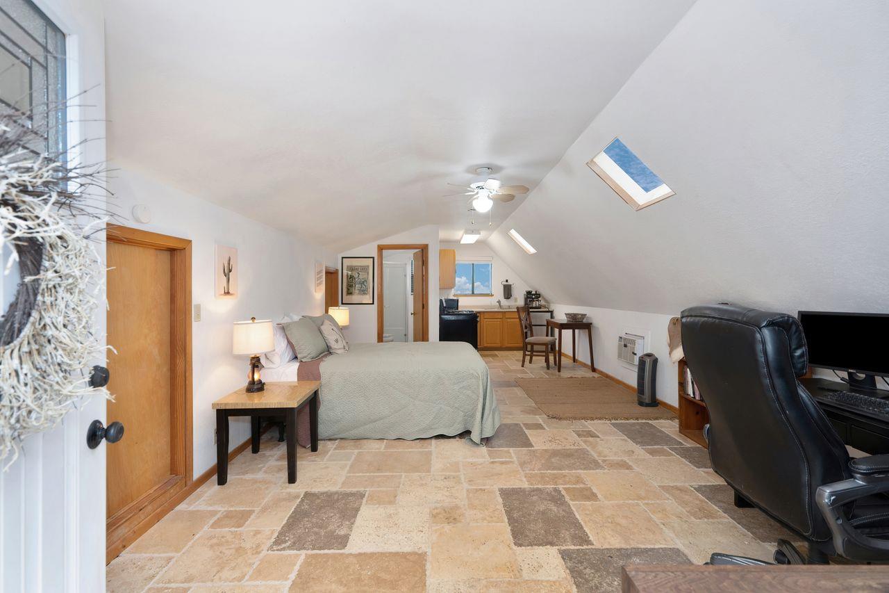 5501 Scott Road Sloughhouse, CA 95683 - Photo 60 of 87 a living room with furniture a lamp and a dining table with wooden floor