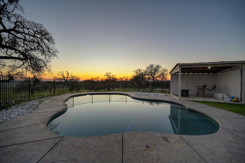 5501 Scott Road Sloughhouse, CA 95683 - Photo 75 of 87 a view of a swimming pool with a yard