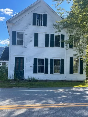 a view of a brick building with many windows
