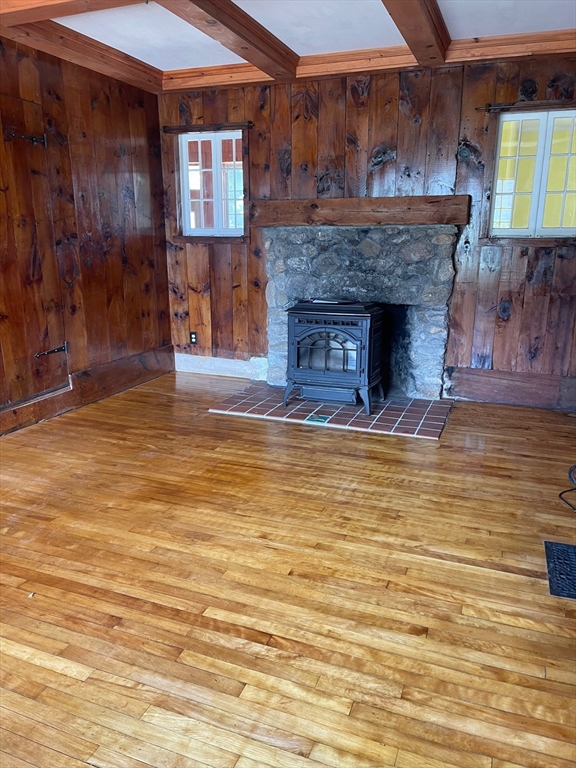 662 Main Street Ashby, MA 01431 - Photo 2 of 20 a view of a livingroom with a fireplace and window