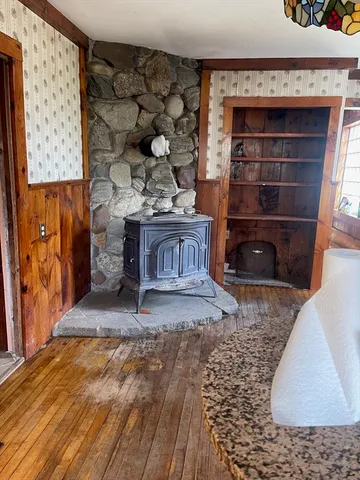a view of fireplace and wooden floor