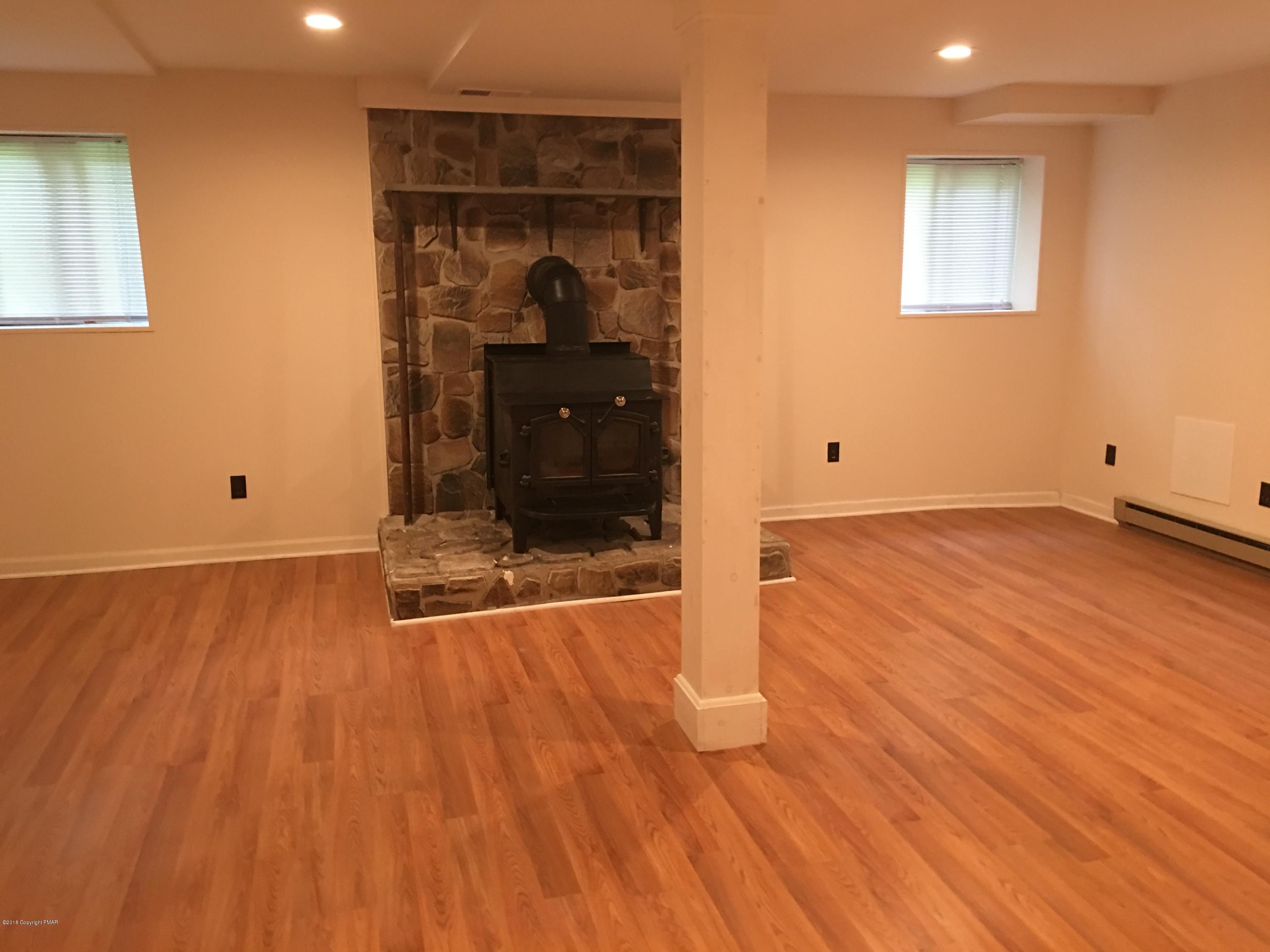 35 Kensington Road Hawley, PA 18428 - Photo 12 of 21 wooden floor in an empty room with a window