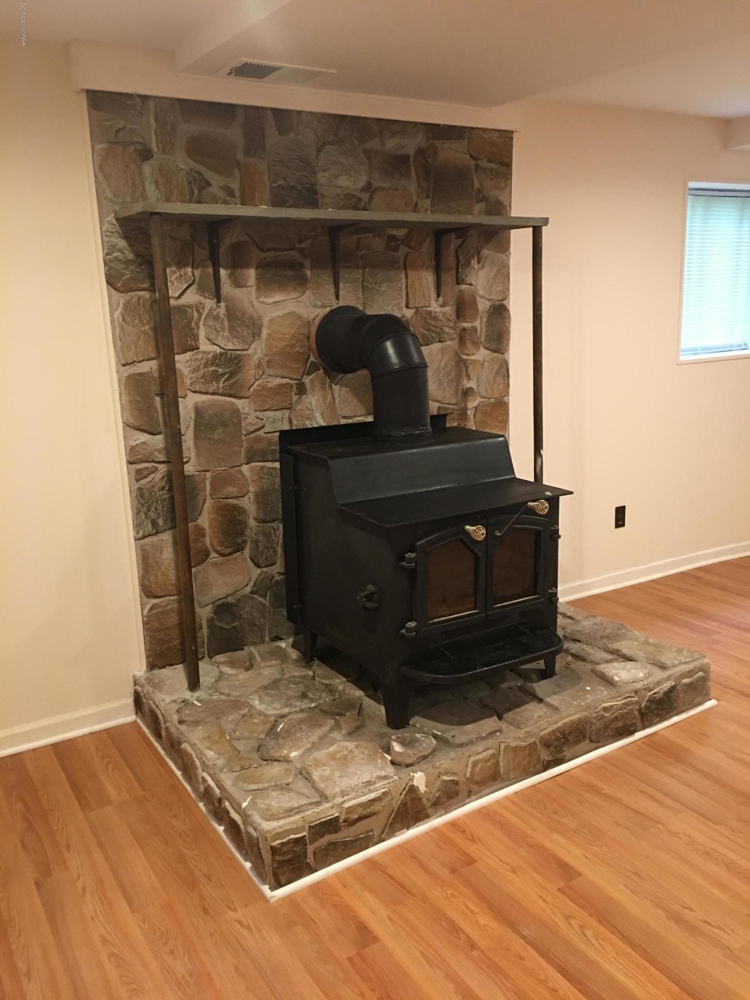 35 Kensington Road Hawley, PA 18428 - Photo 13 of 21 a room with fireplace