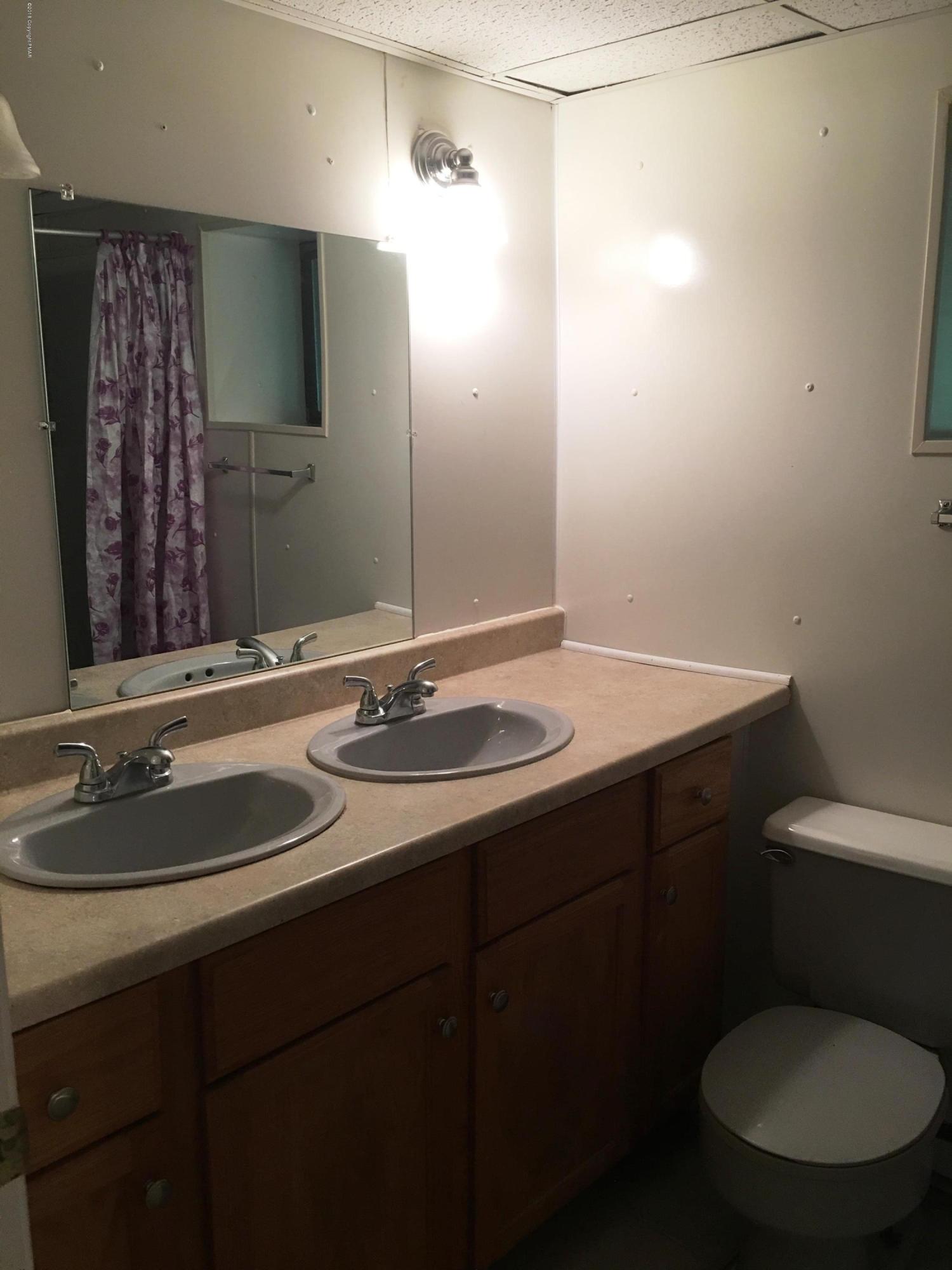 35 Kensington Road Hawley, PA 18428 - Photo 14 of 21 a bathroom with a sink toilet a mirror and shower