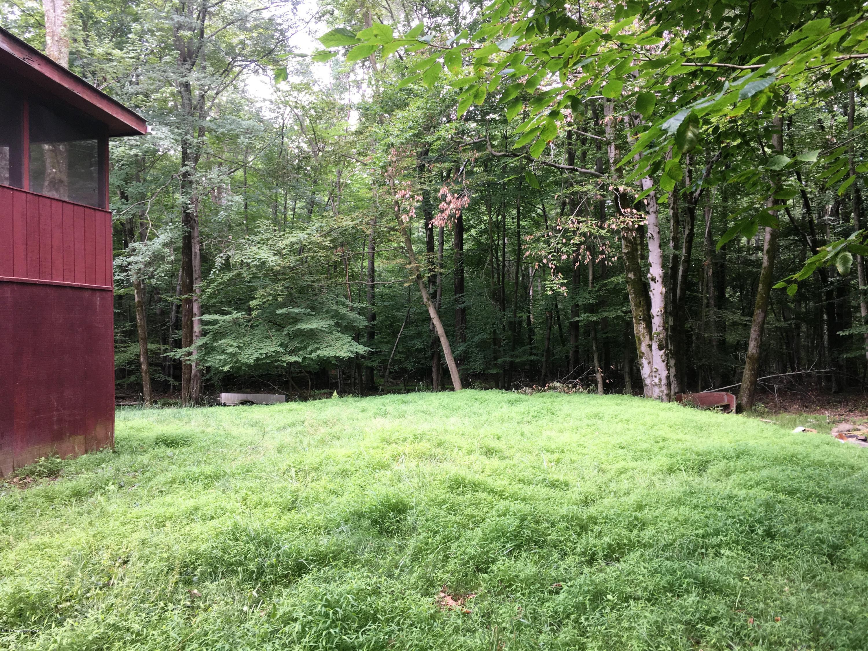 35 Kensington Road Hawley, PA 18428 - Photo 17 of 21 a backyard of a house with lots of green space