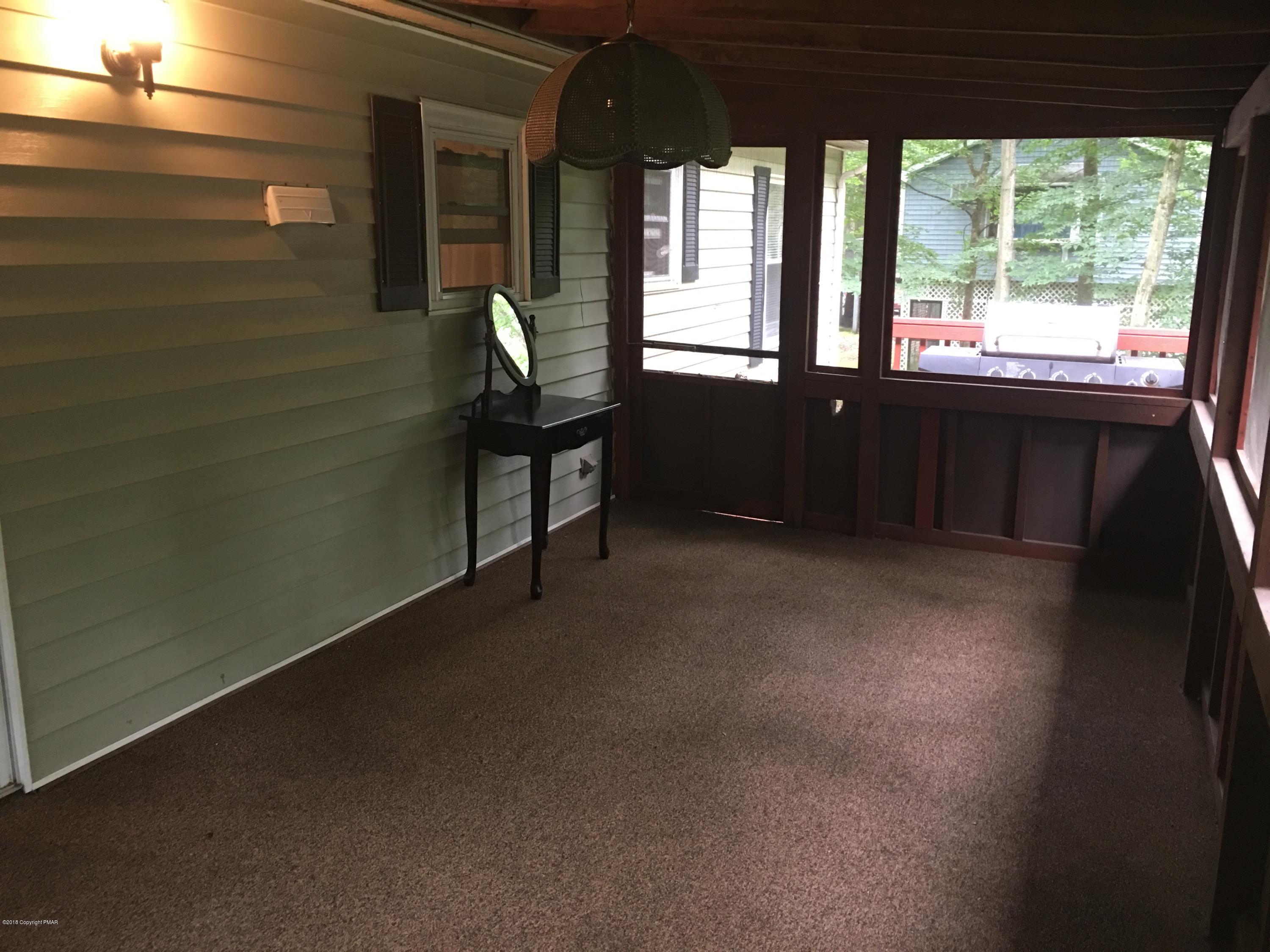 35 Kensington Road Hawley, PA 18428 - Photo 5 of 21 a view of an empty room with a window