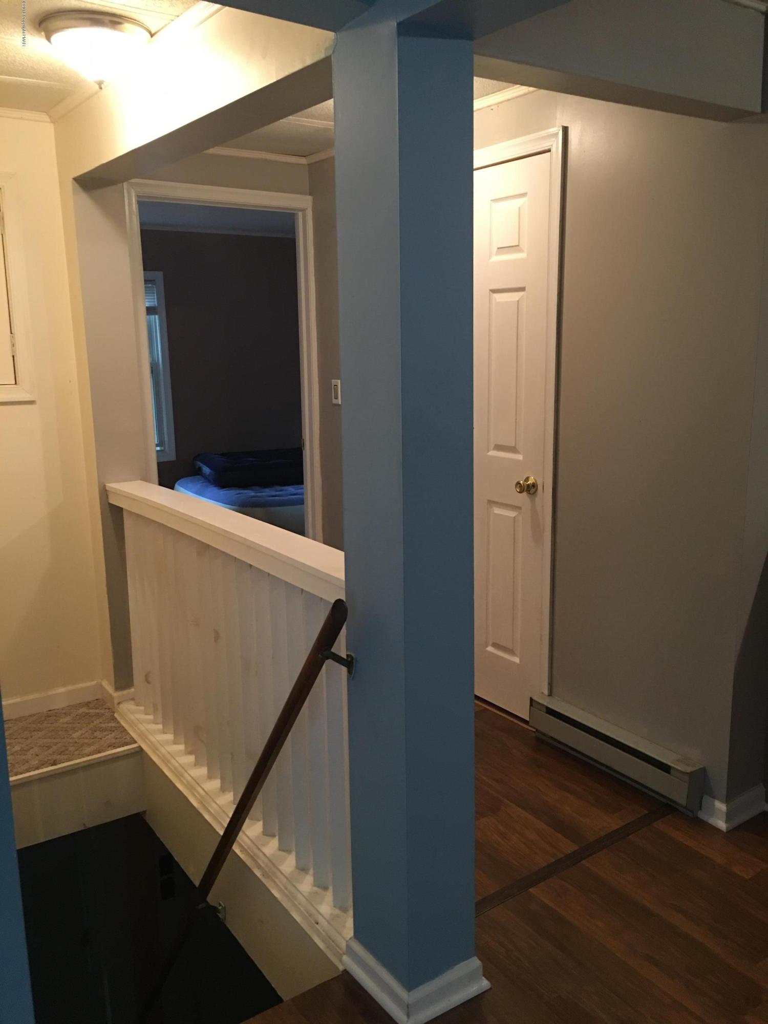 35 Kensington Road Hawley, PA 18428 - Photo 7 of 21 a view of an empty room with wooden floor