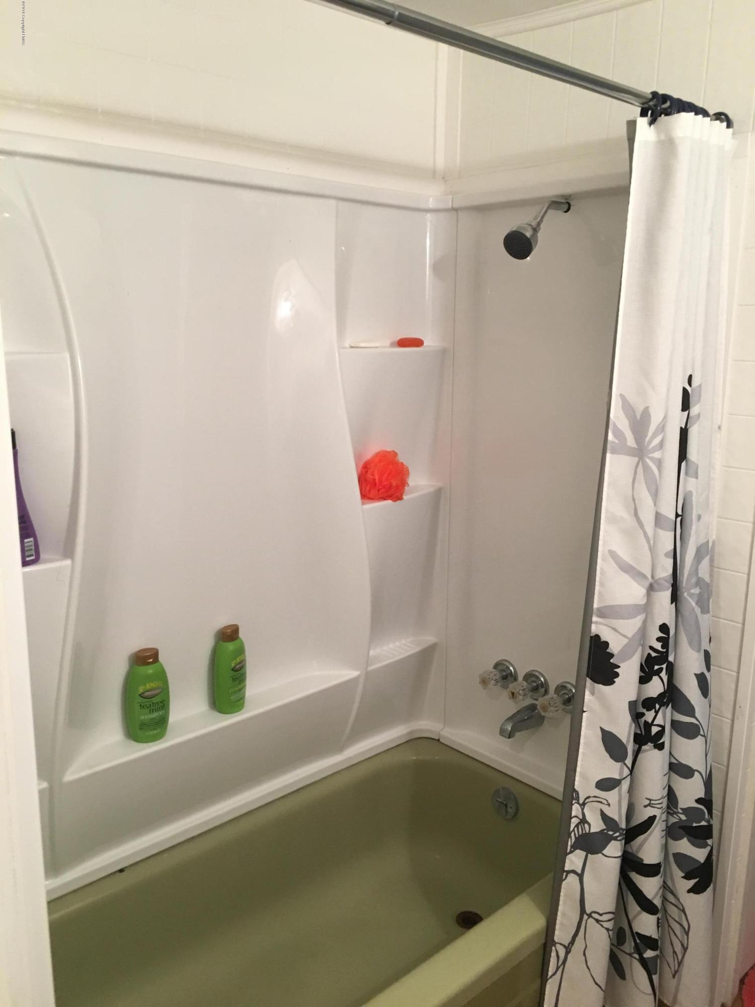 35 Kensington Road Hawley, PA 18428 - Photo 8 of 21 a bathroom with a bathtub and shower