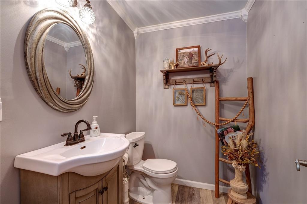 4249 Hollow Road New Castle, PA 16101 - Photo 17 of 33 a bathroom with a sink mirror and toilet