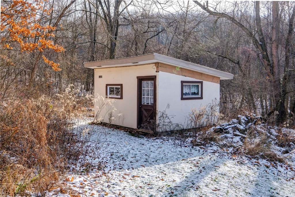 4249 Hollow Road New Castle, PA 16101 - Photo 4 of 33 a view of a small house with a yard