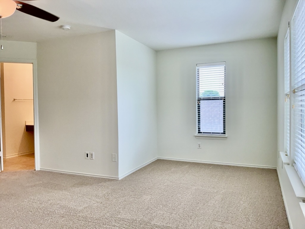 2242 Perkins Place Georgetown, TX 78626 - Photo 11 of 25 Spacious room featuring neutral carpeting, light-toned walls, and a ceiling fan