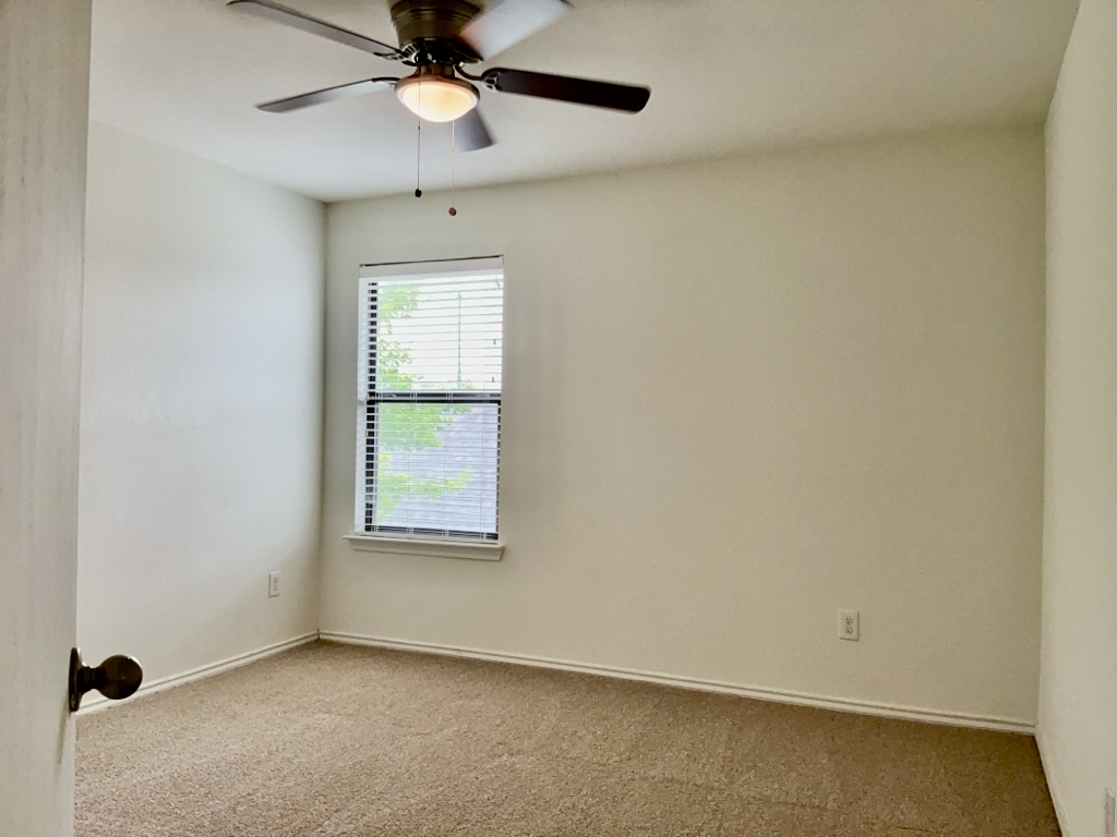 2242 Perkins Place Georgetown, TX 78626 - Photo 17 of 25 Spacious room with neutral wall tones and plush carpeting