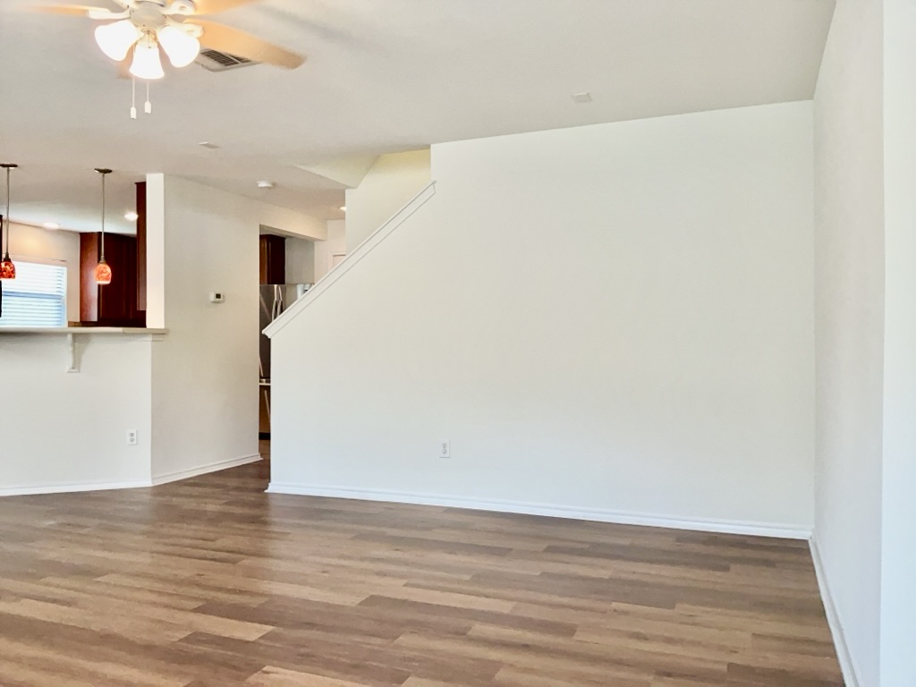 2242 Perkins Place Georgetown, TX 78626 - Photo 4 of 25 Expansive living area featuring wood-finish flooring and light-toned walls