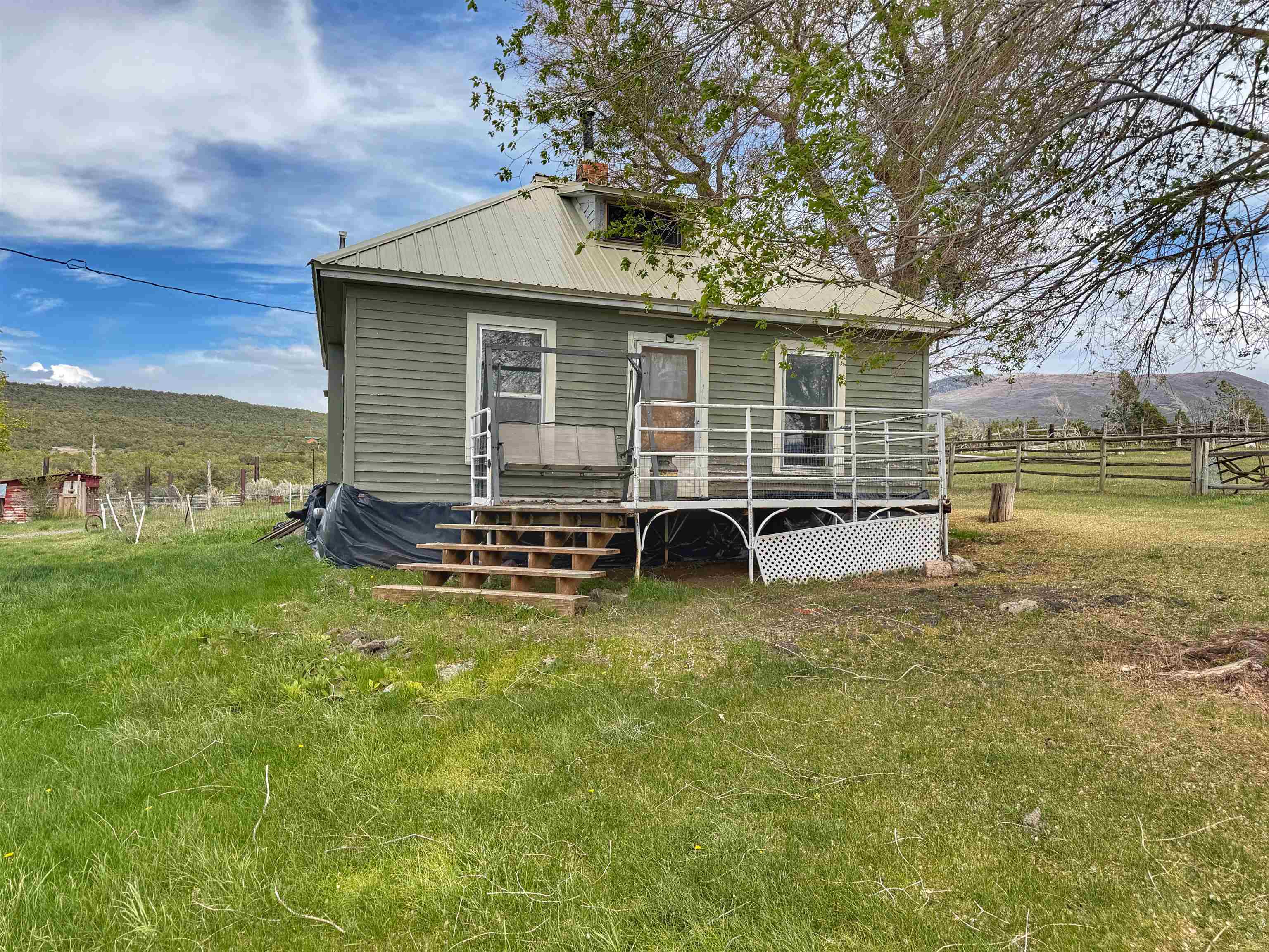 11260 54 7/10 Road Molina, CO 81646 - Photo 12 of 31 a view of a house with backyard and sitting area