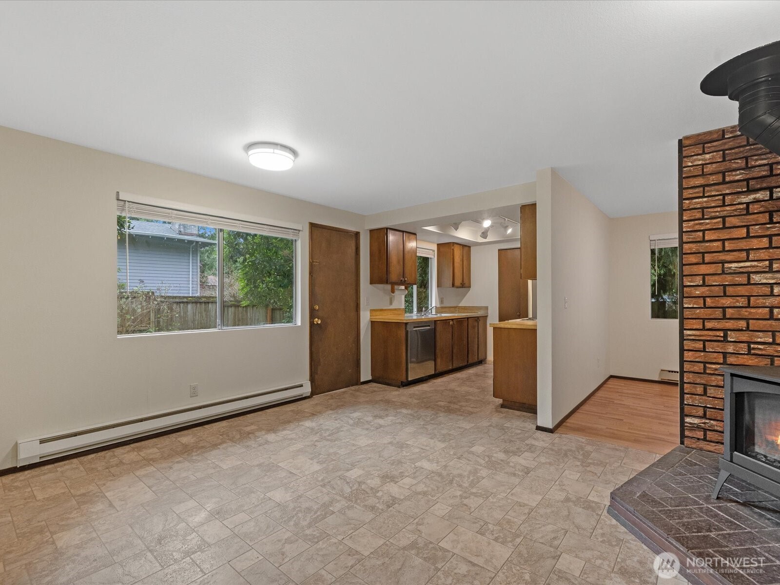 8506 192nd Street Southwest Edmonds, WA 98026 - Photo 16 of 37 a view of kitchen with furniture and refrigerator