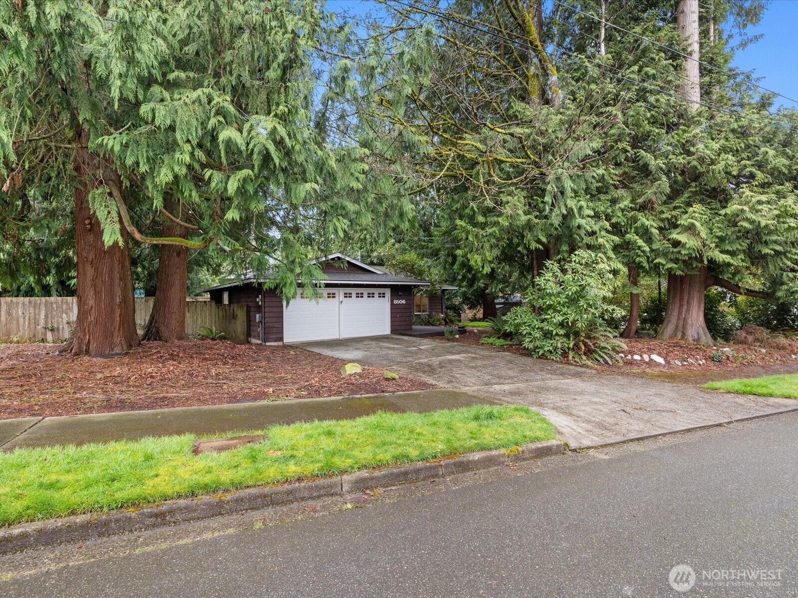 8506 192nd Street Southwest Edmonds, WA 98026 - Photo 2 of 37 a front view of a house with a yard and garage