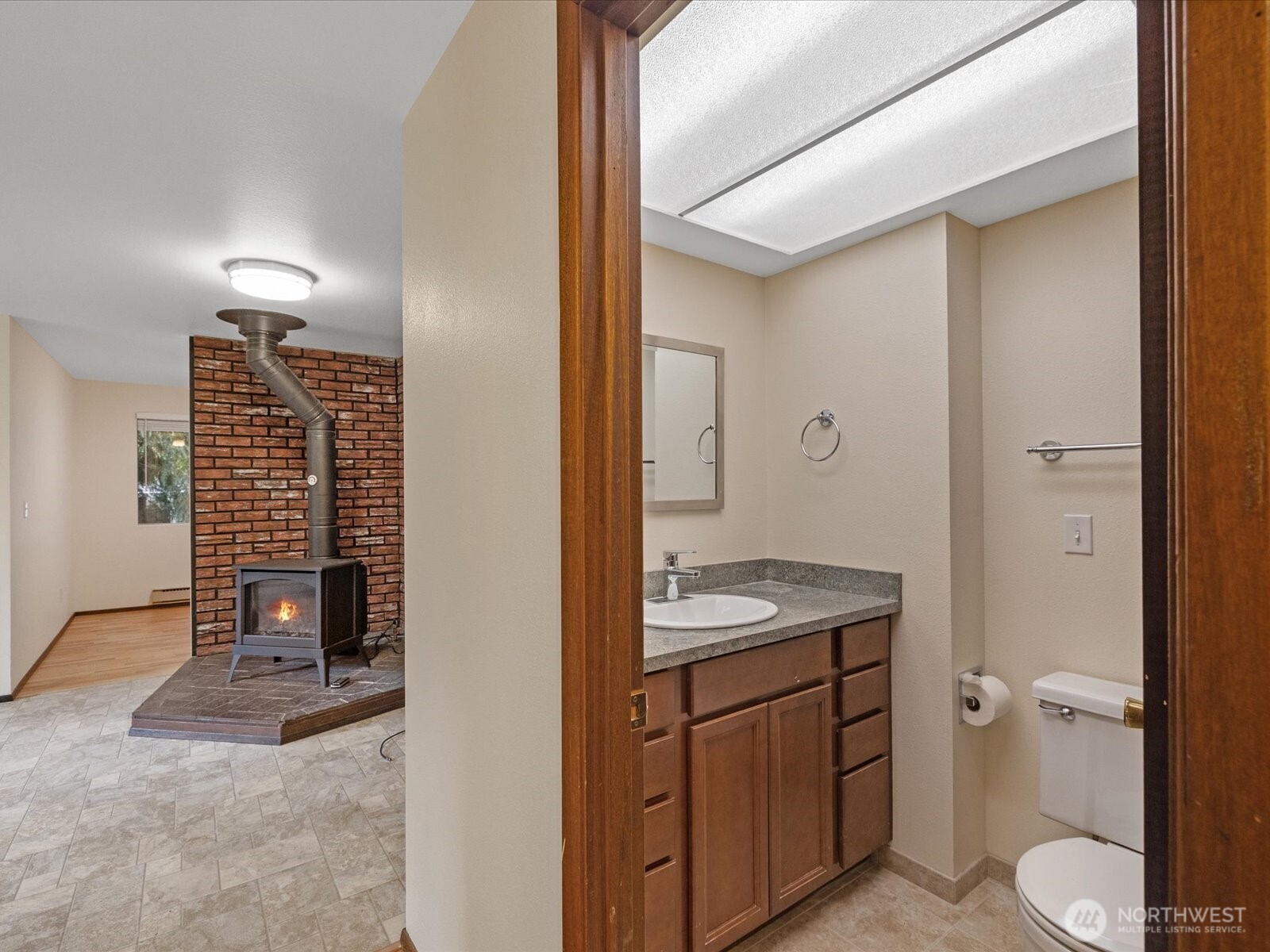 8506 192nd Street Southwest Edmonds, WA 98026 - Photo 22 of 37 a bathroom with a granite countertop toilet sink and mirror