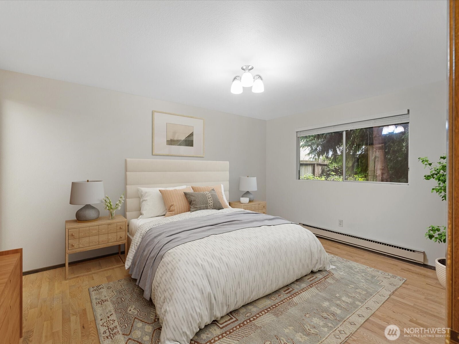 8506 192nd Street Southwest Edmonds, WA 98026 - Photo 25 of 37 a bedroom with a bed and a painting on the wall
