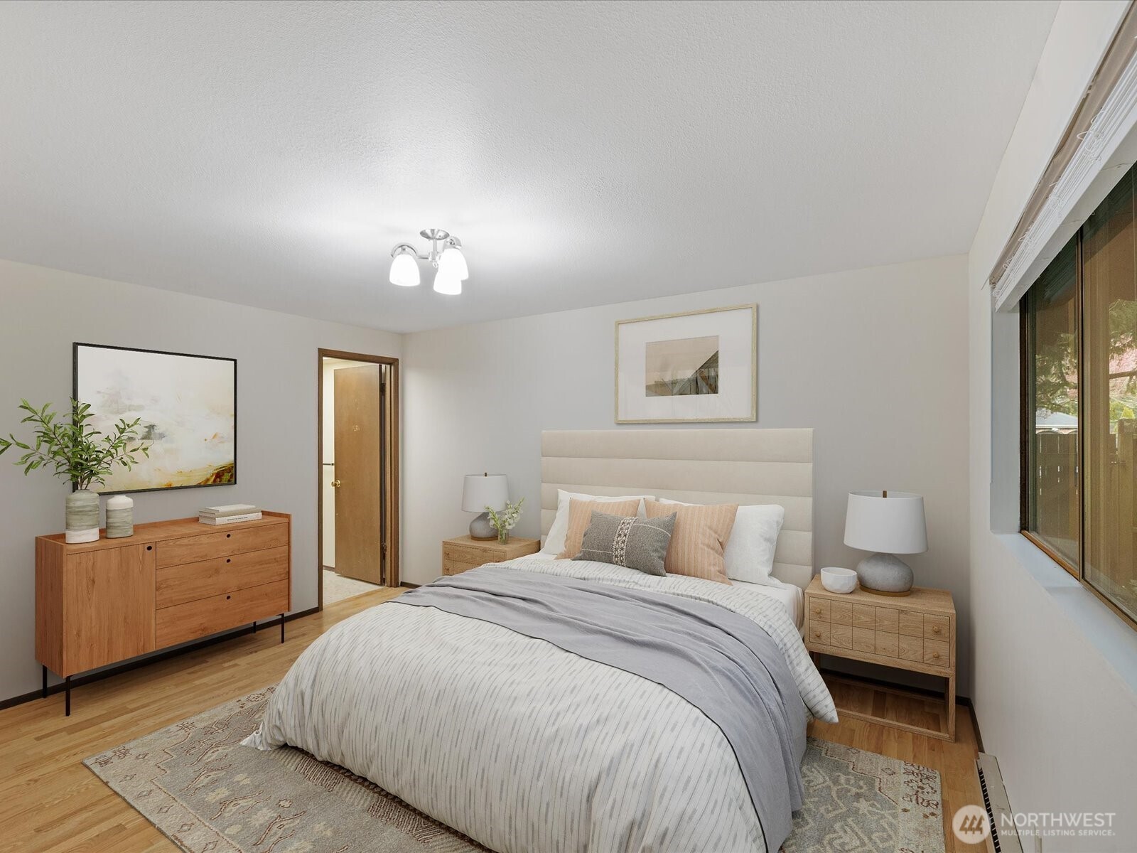 8506 192nd Street Southwest Edmonds, WA 98026 - Photo 26 of 37 a bedroom with a large bed and a window