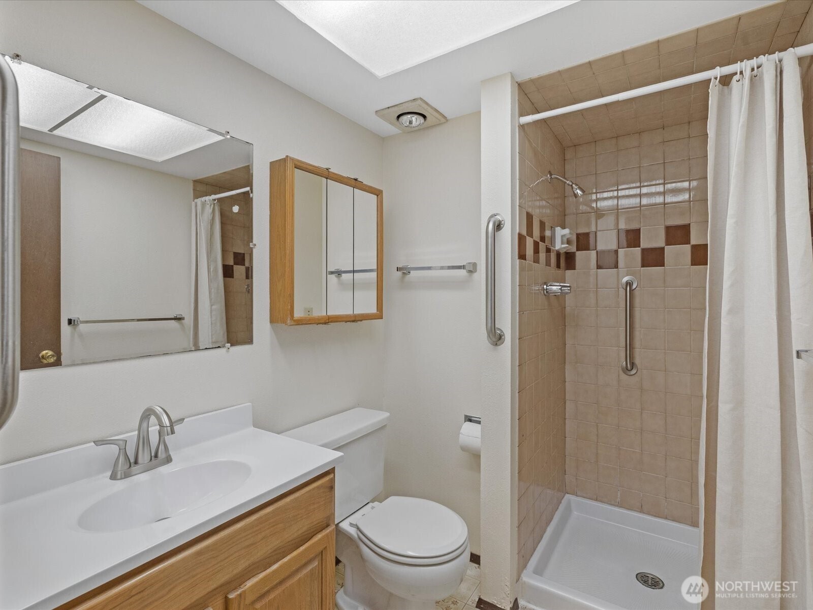 8506 192nd Street Southwest Edmonds, WA 98026 - Photo 27 of 37 a bathroom with a sink a toilet and shower