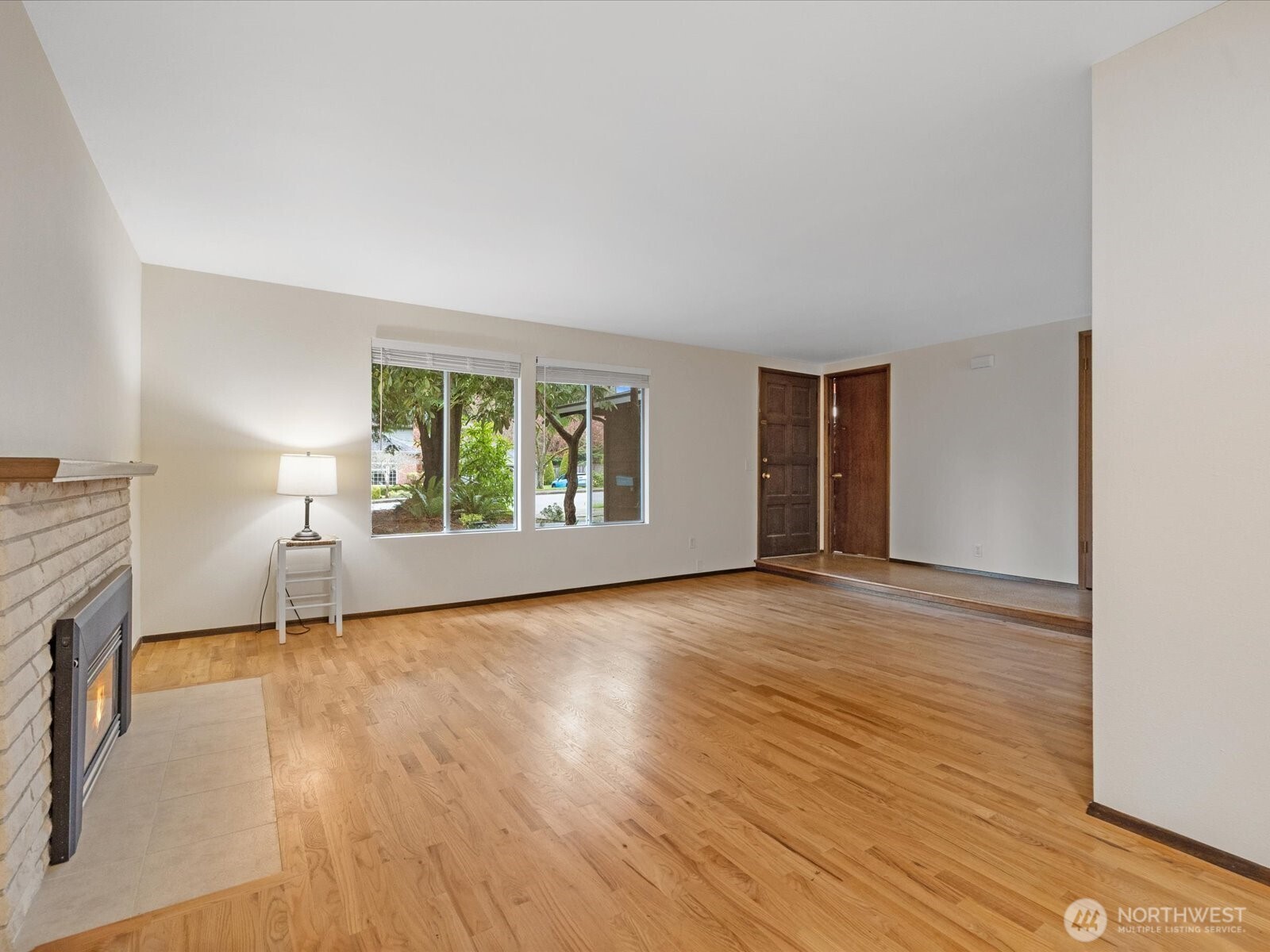 8506 192nd Street Southwest Edmonds, WA 98026 - Photo 8 of 37 a view of an empty room with a window and wooden floor