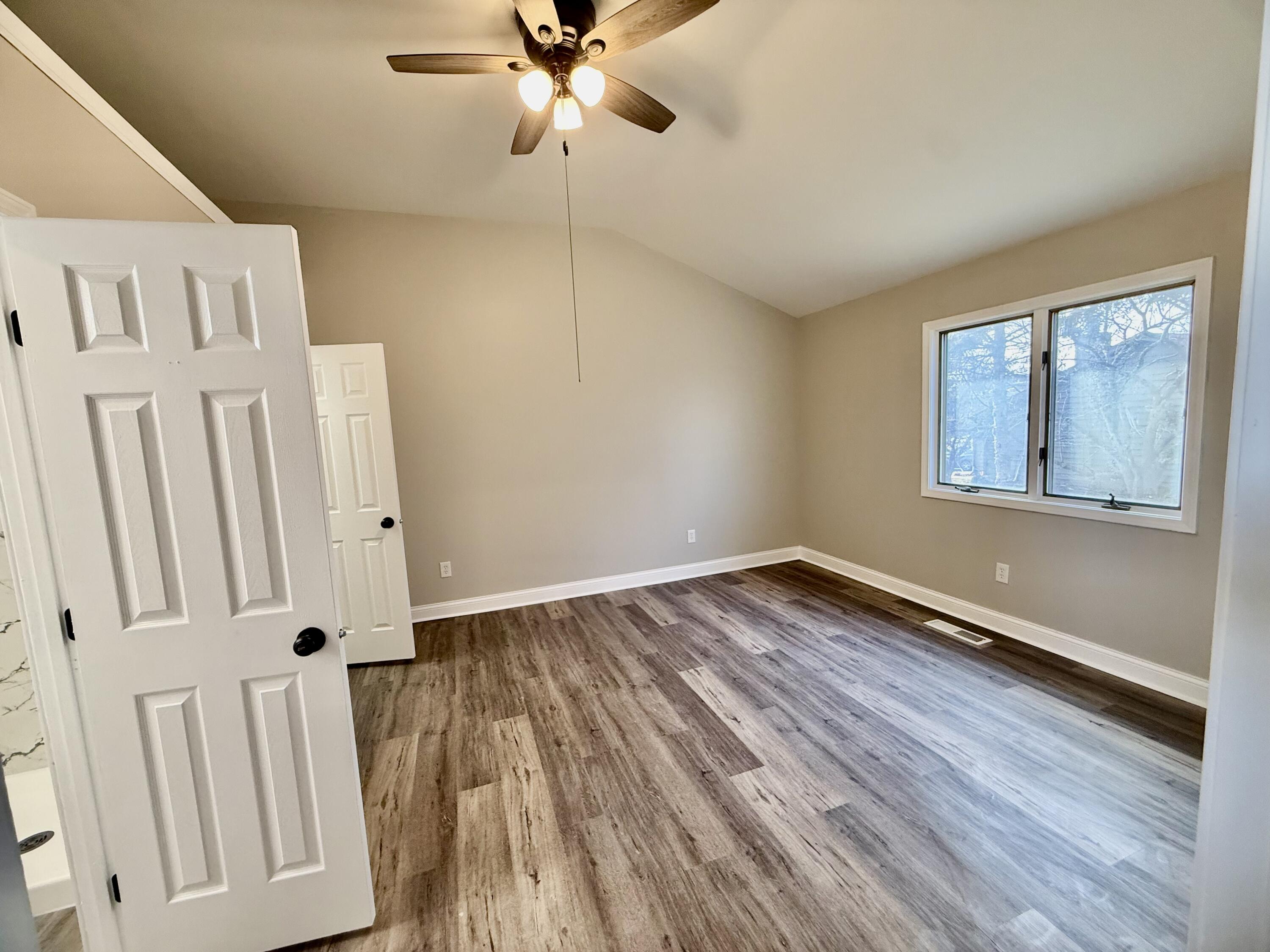1962 Aspen Court Crown Point, IN 46307 - Photo 23 of 27 wooden floor in an empty room with a window
