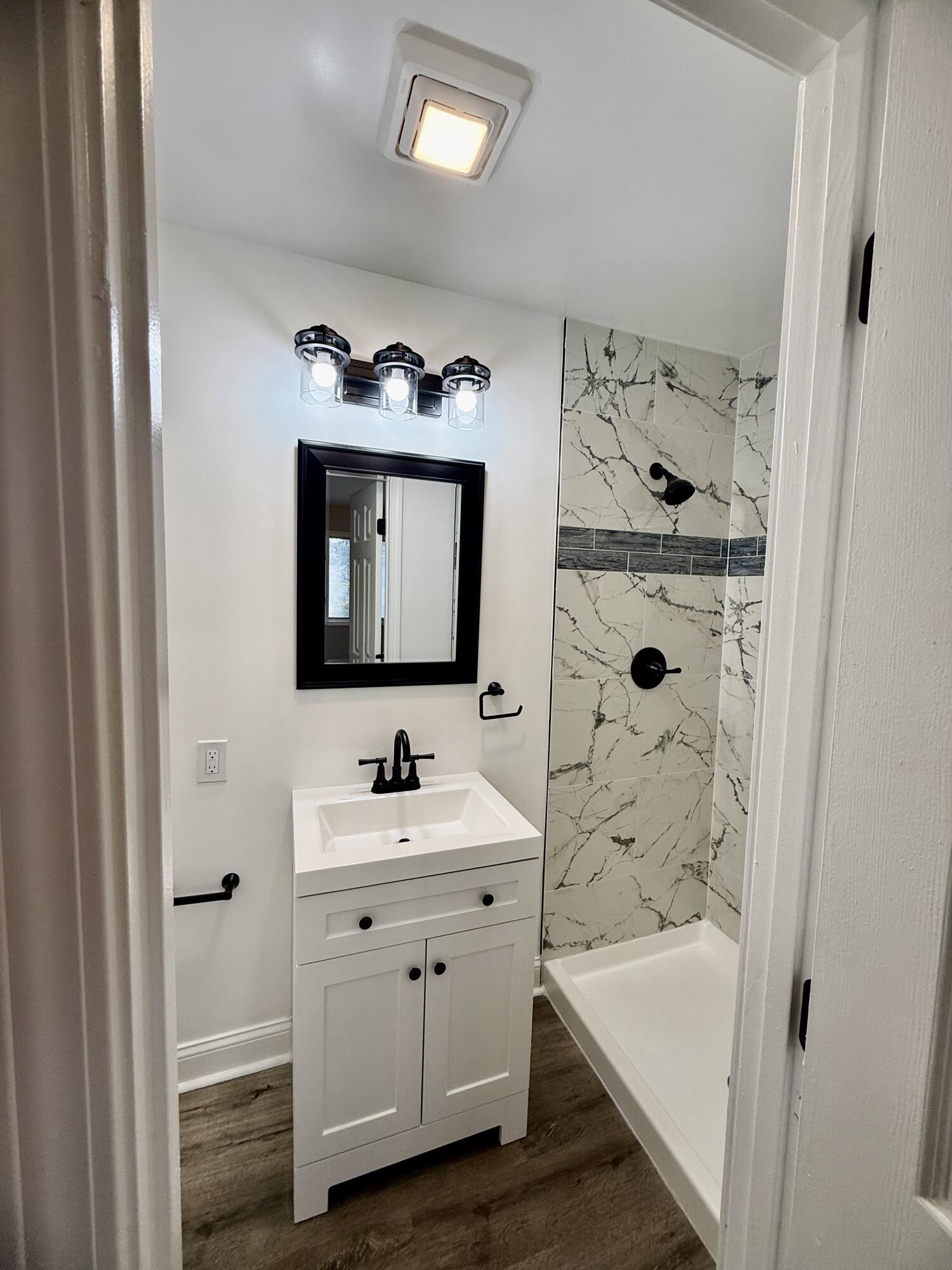 1962 Aspen Court Crown Point, IN 46307 - Photo 24 of 27 a bathroom with a tub sink and mirror