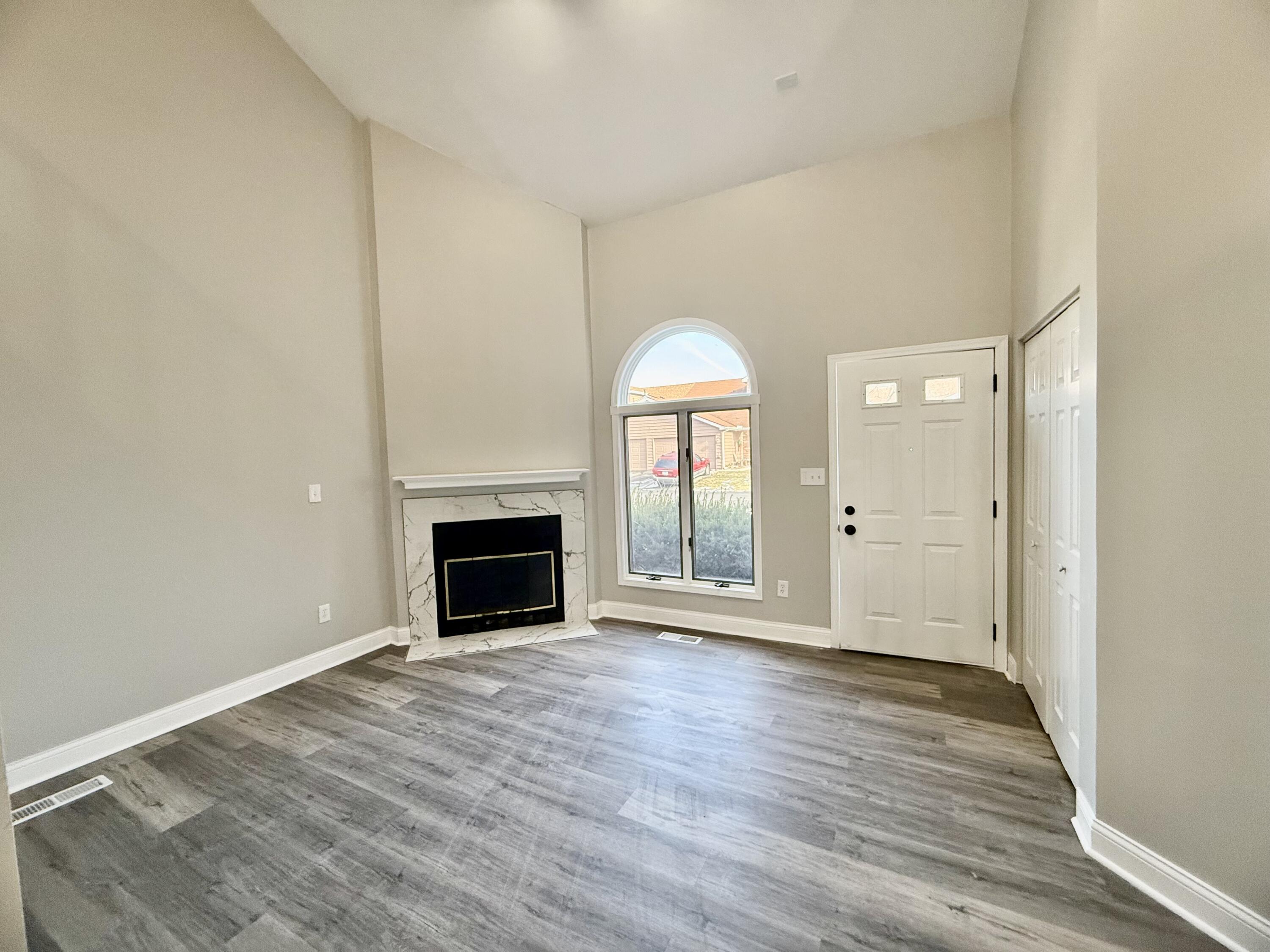 1962 Aspen Court Crown Point, IN 46307 - Photo 5 of 27 wooden floor fireplace and natural light in room