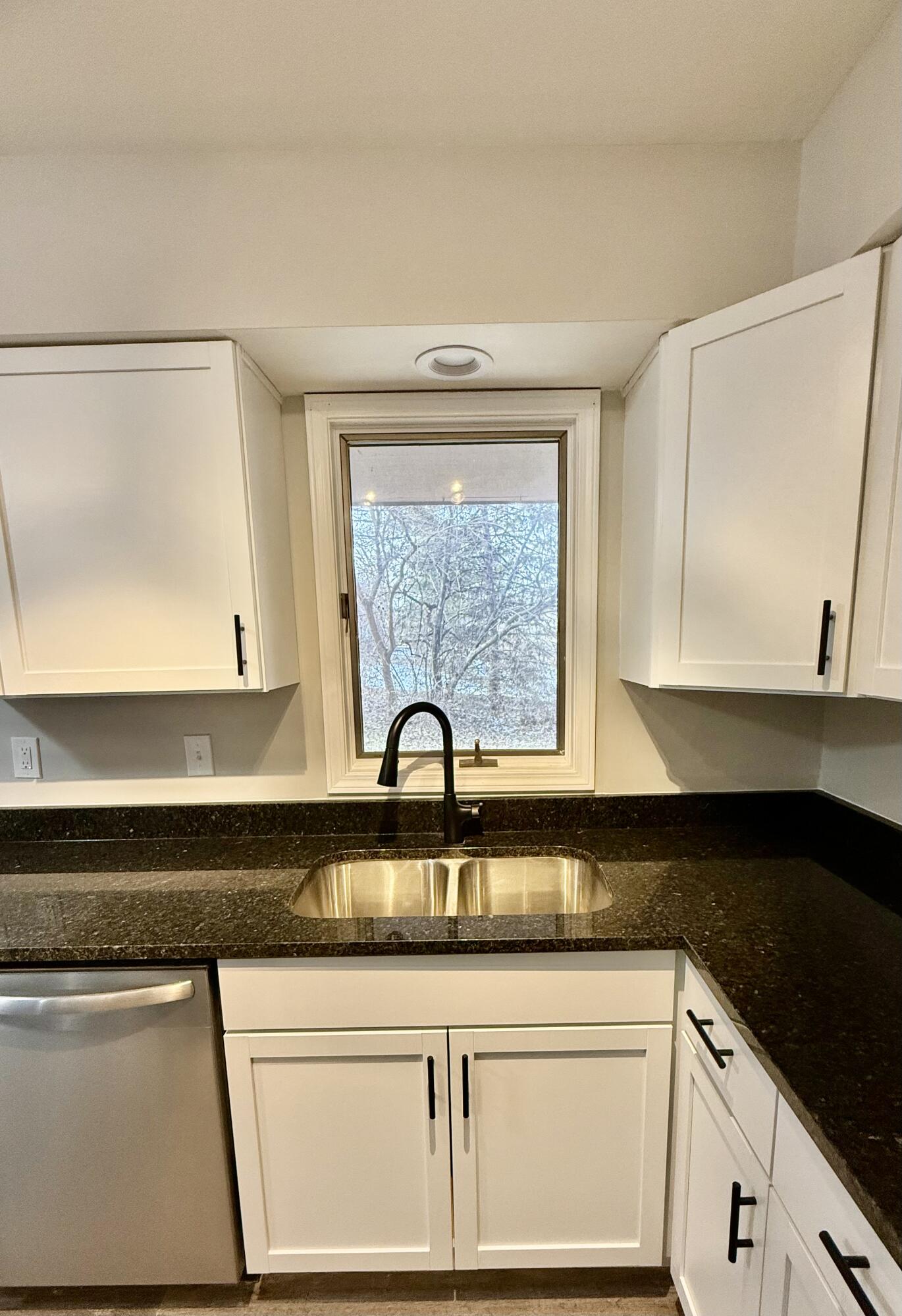 1962 Aspen Court Crown Point, IN 46307 - Photo 7 of 27 a kitchen with granite countertop a sink and a stove