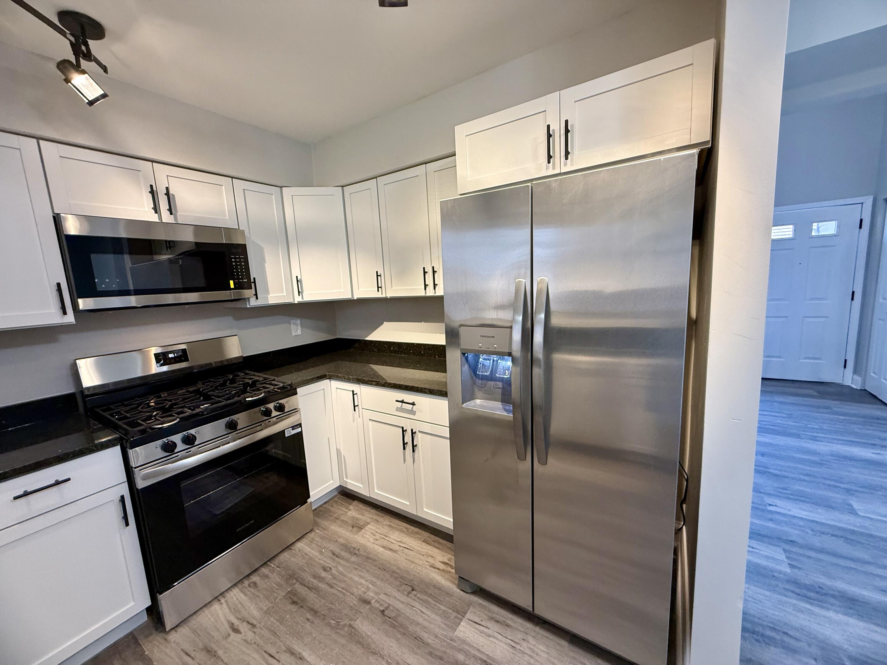 1962 Aspen Court Crown Point, IN 46307 - Photo 9 of 27 a kitchen with a refrigerator stove and microwave