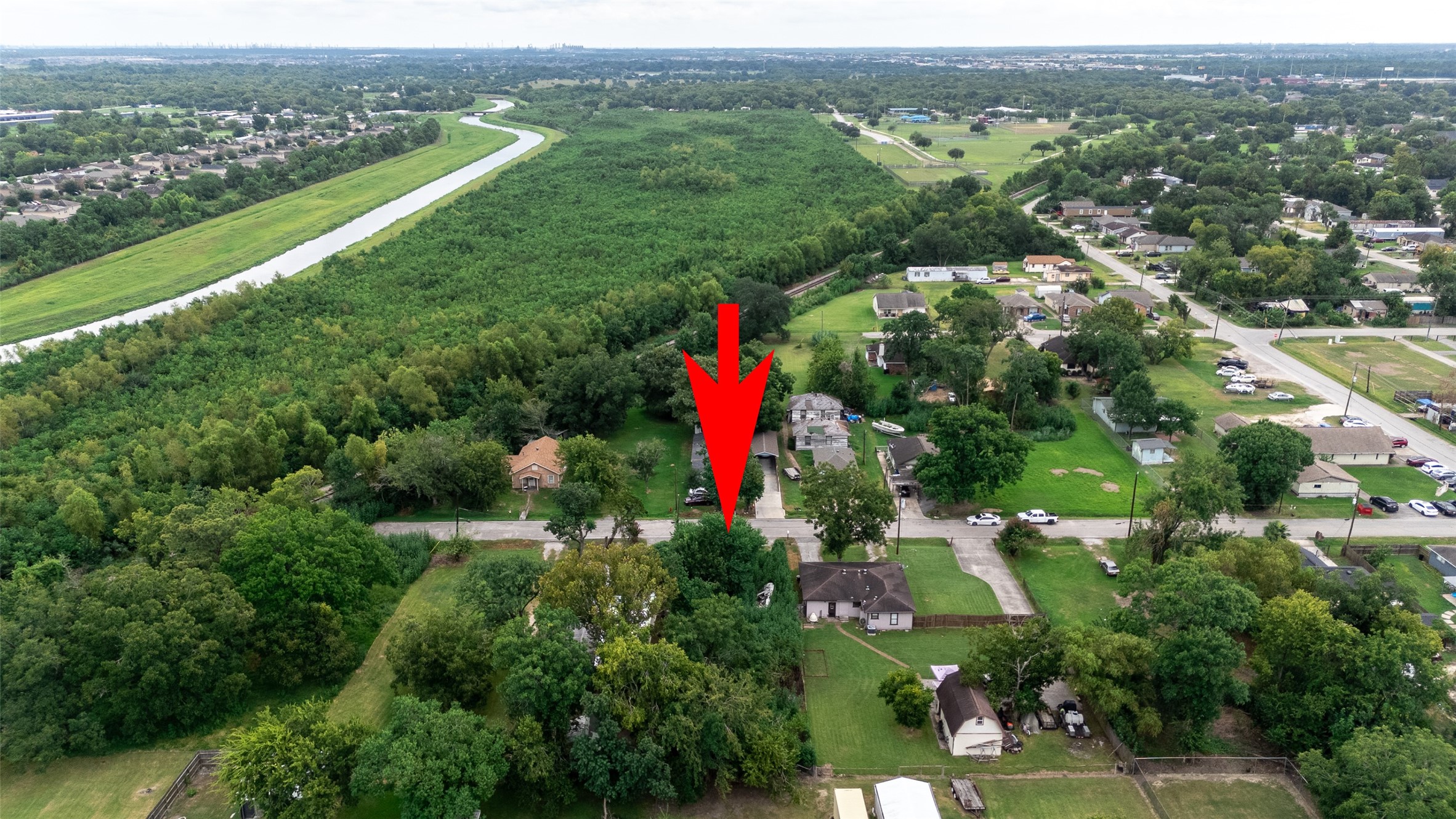 7731 North Perry Street Baytown, TX 77521 - Photo 7 of 8 an aerial view of residential houses with outdoor space and trees