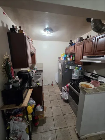 a room with furniture a flat screen tv and a window