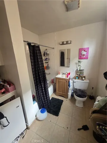 a room with gym equipment and a flat screen tv